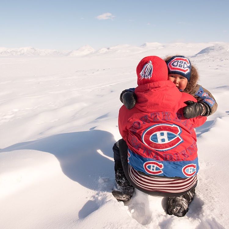 A mother and son pose in their Montreal Canadiens clothing.