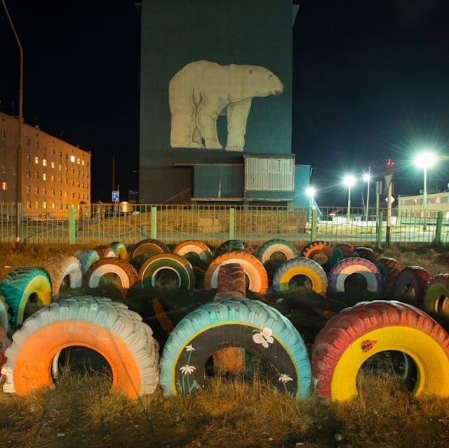 Polar bear and tire art in Russia.